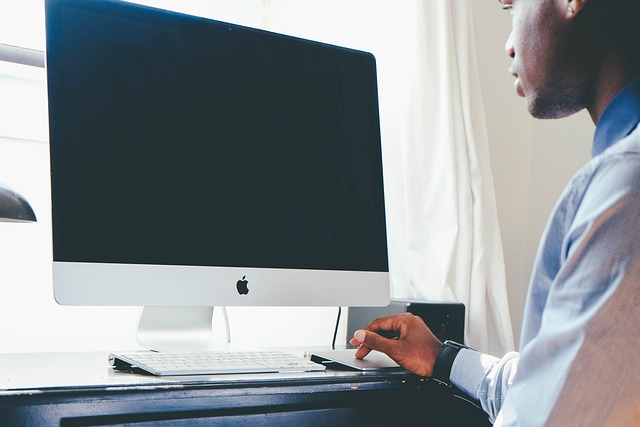 man in front of computer